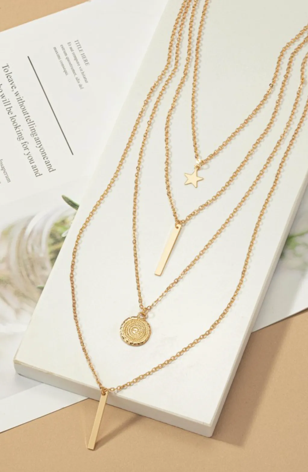 Four Row Mixed Chain with Star, Coin and Bar Pendants