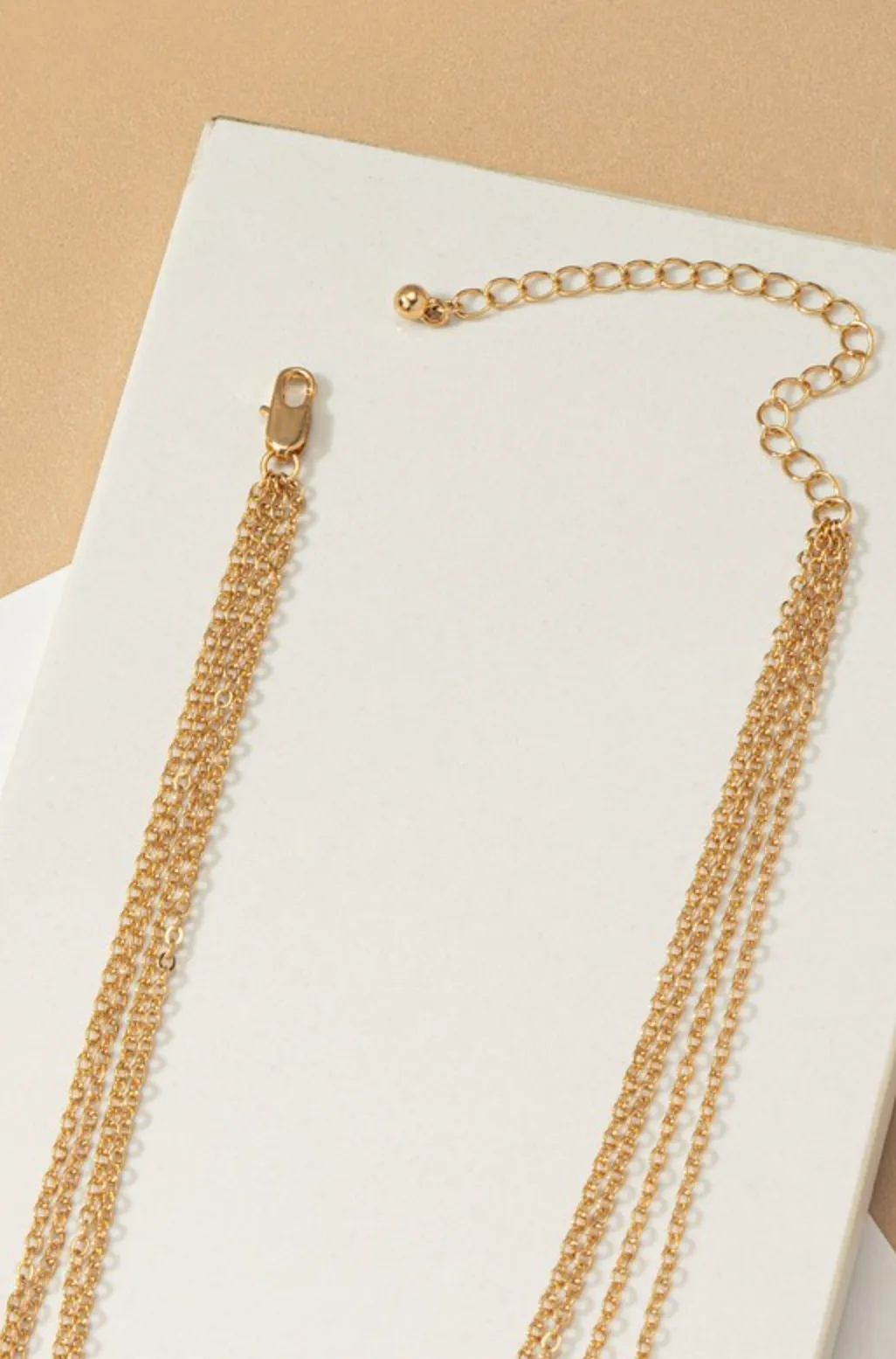 Four Row Mixed Chain with Star, Coin and Bar Pendants