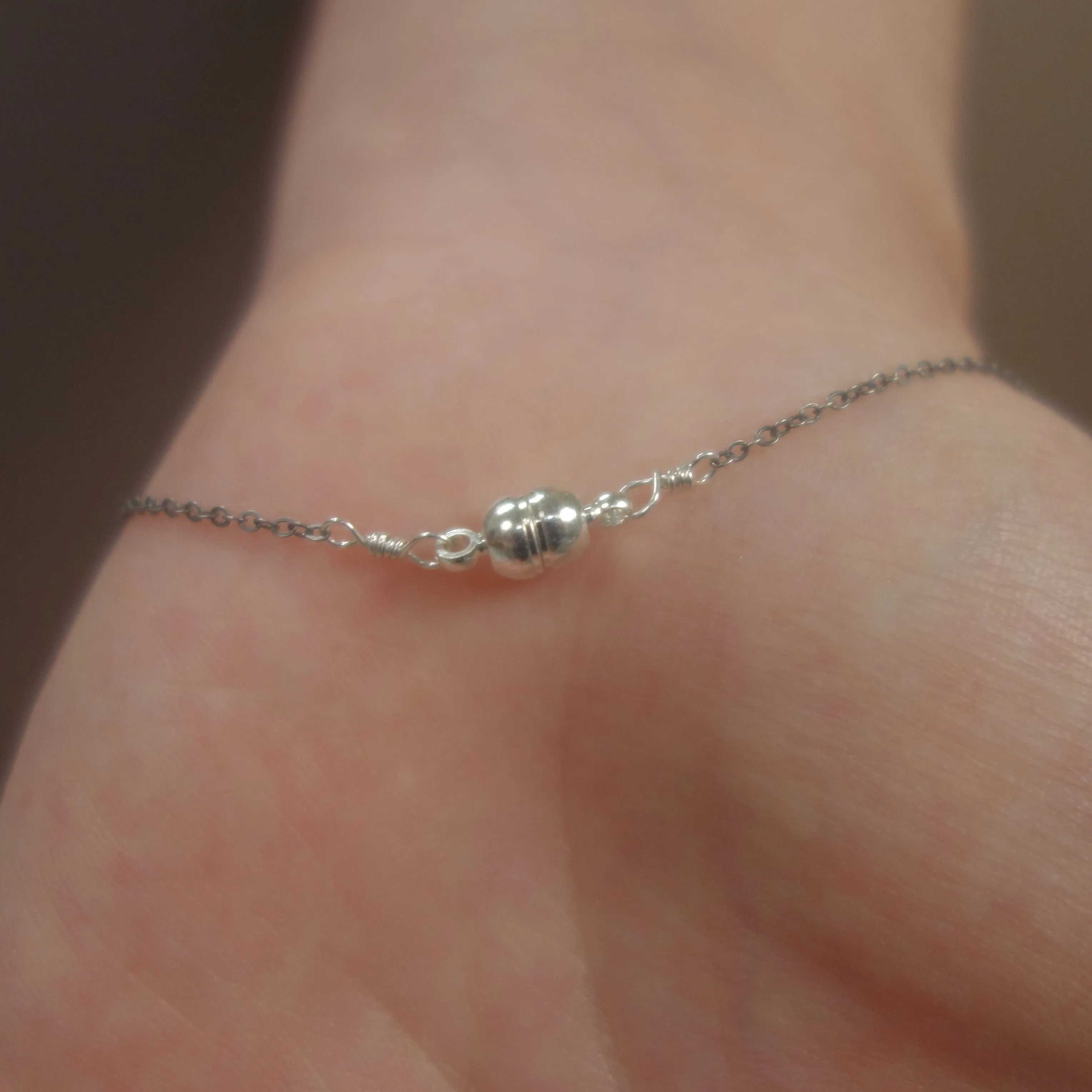 Hand stamped initial on silver/gold with briolette and gem (school colors)