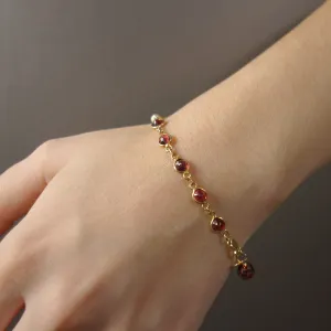 Mr. Darcy, I Presume (hand hammered gold, garnet bangle)