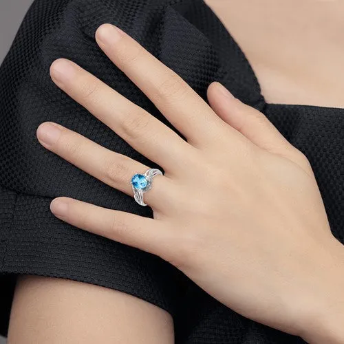 Sterling Silver Diamond And Oval Swiss Blue Topaz Ring
